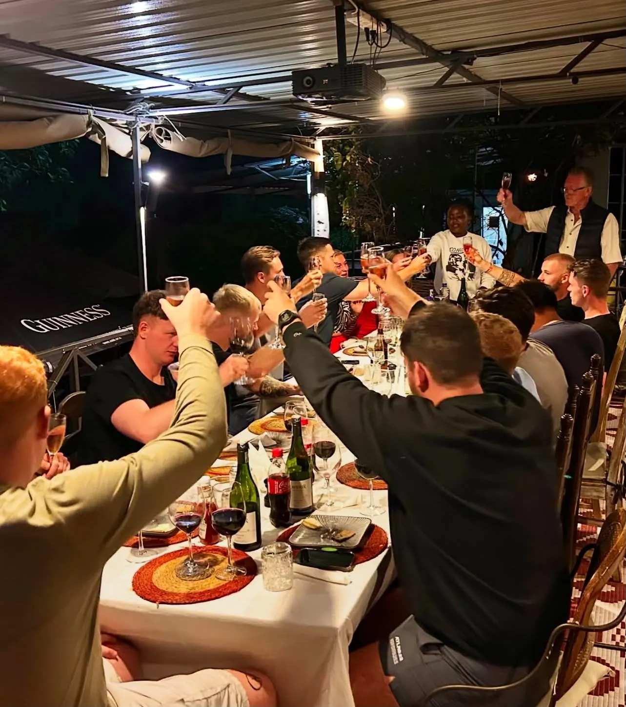 Guests sharing a meal together in the evening