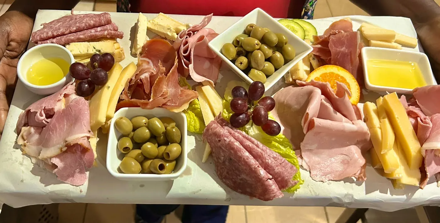 A selection of artisan foods arranged on a serving board