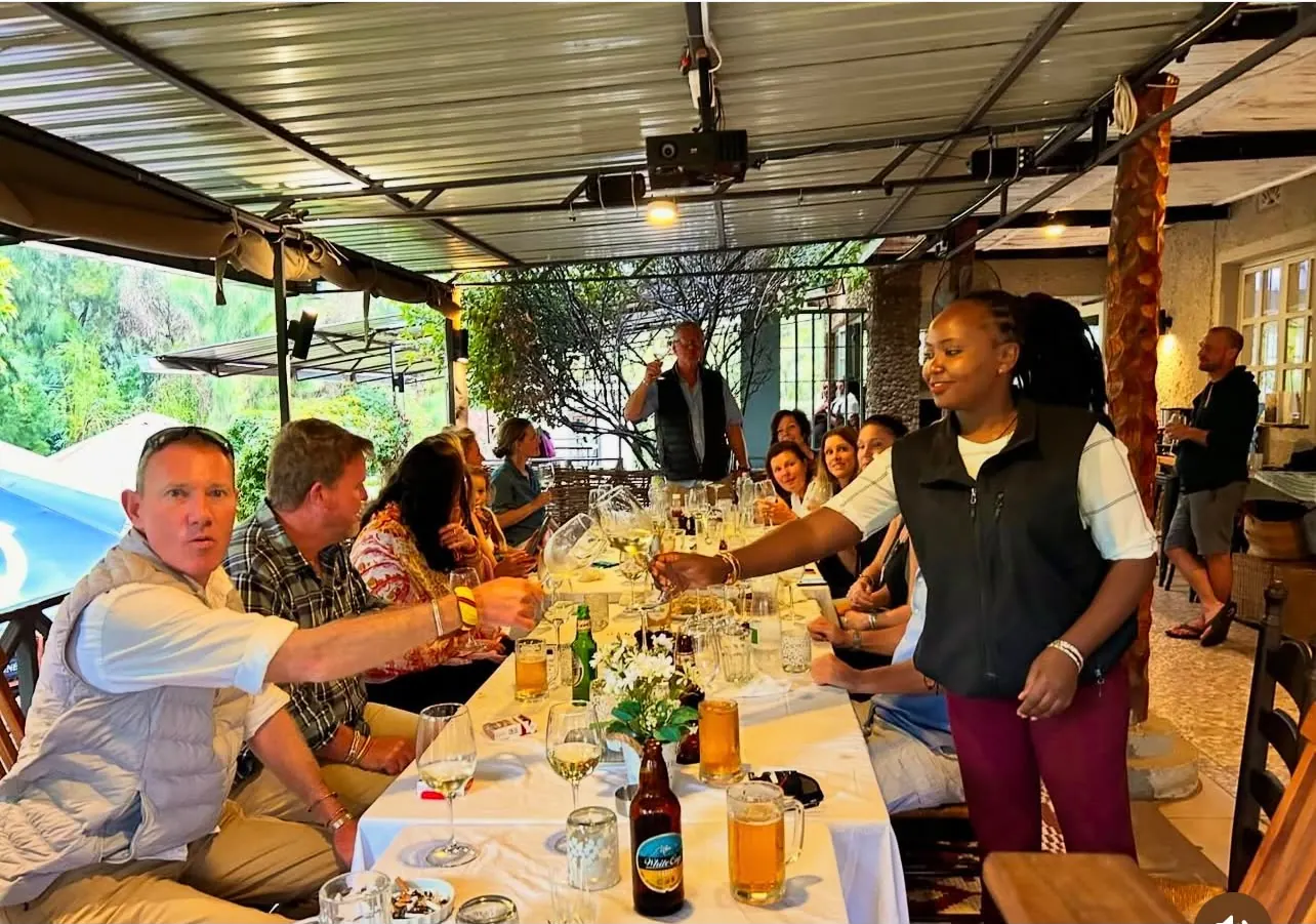 Guests enjoying food together around a dining table